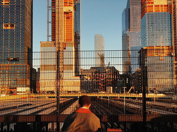 Boy overlooking urban landscape
