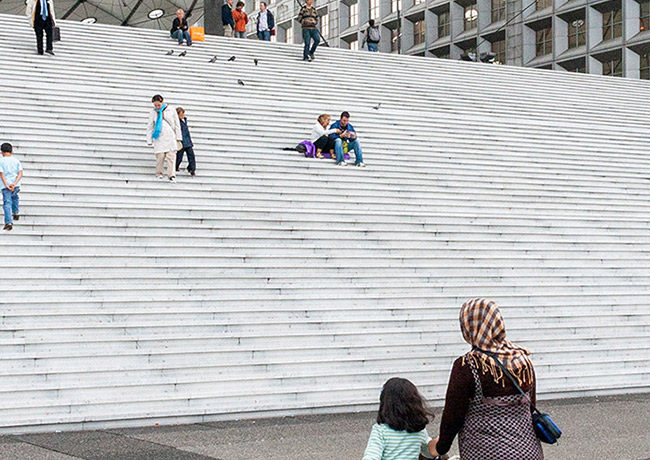 Immigrants walking to cultural institution