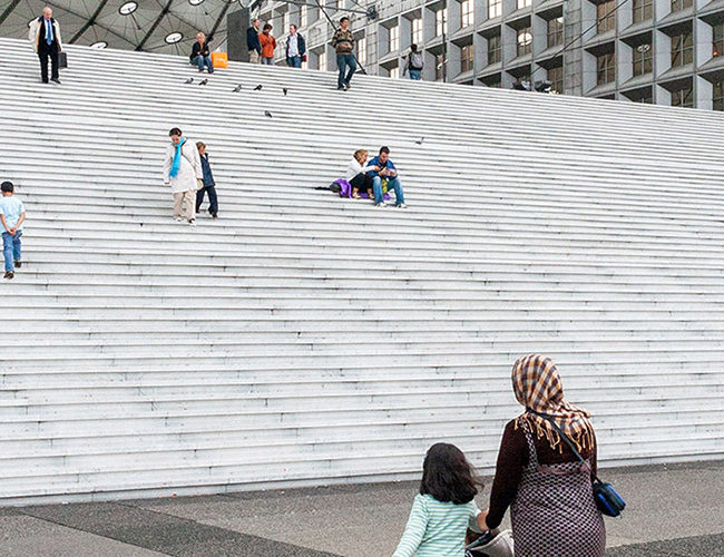 Immigrants walking to cultural institution