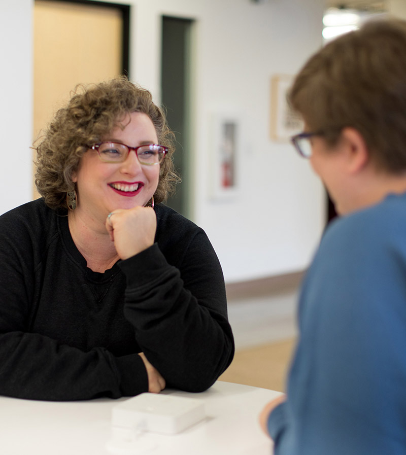Woman listening to person